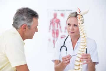 doctor holding spine
