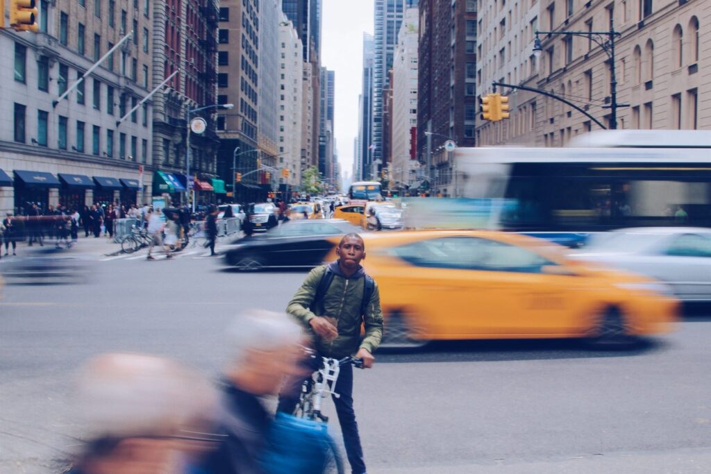 man on bike in traffic